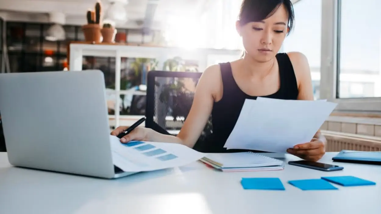 woman-laptop-paperwork